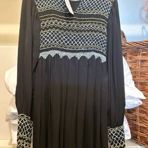 New with tags. Black with blue and yellow, threading, long sleeve dress